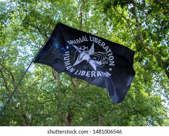 London, UK - Aug 17, 2019: Animal Rights March. Animal Liberation Black Flag.