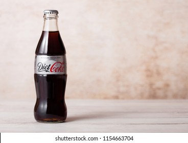 LONDON, UK - AUGUST 03, 2018: Glass bottle of Diet Coke Coca Cola soft drink on wood. Most popular drink in the world.