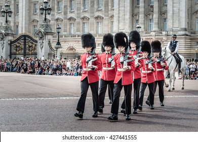 London, UK - August 19, 2015: Royal Guards parade during traditional Changing of the Guards ceremony near Buckingham Palace. This ceremony is one of the most popular tourist attractions in London.