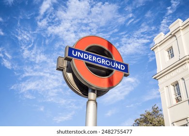 London, UK- August 19, 2023: London underground sign on the background of clouds in the sky. - Powered by Shutterstock