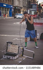 London, UK - August, 2018. A street artist performing beat-box outside a Tube station in central London.
