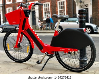 LONDON, UK - AUGUST 21, 2019: A Jump Dockless Electric Bicycle Parked On The Pavement In A Street In North London, UK.