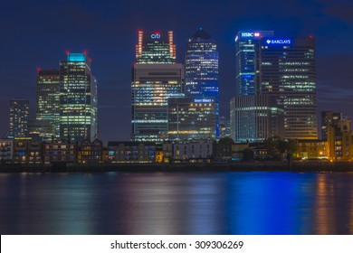 LONDON, UK - AUGUST 22, 2015: Night view of Canary Wharf, a major business district located in London, UK. It's a home to the headquarters of numerous major banks and other professional service firms