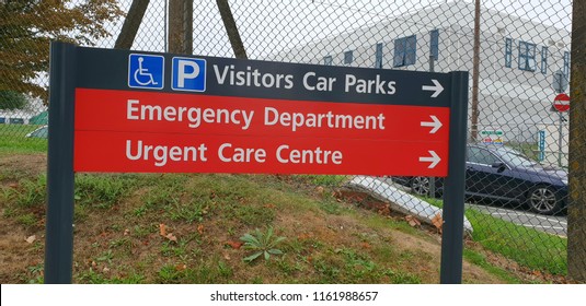 London, Uk, August 22nd 2018:Hospital signpost to the Visitors Car Park, Emergency Department and Urgent Care Centre 