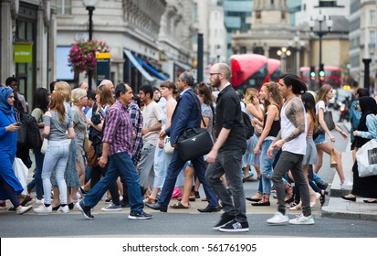London, UK - August 24, 2016:  Lots of people crossing the Regent street at the traffic lights. Populated city concept  