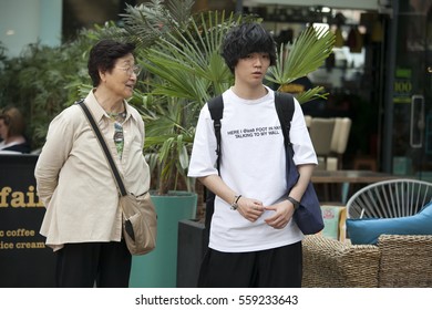 LONDON, UK - August 27, 2016: Mother & Teen Son Tourist Couple On Spitalfilds Market