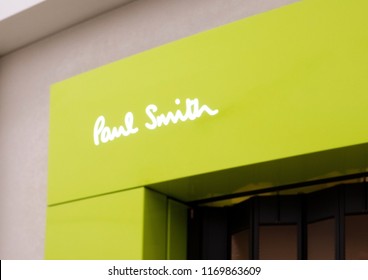 LONDON, UK - AUGUST 31, 2018: Paul Smith logo on display in luxury fashion store.