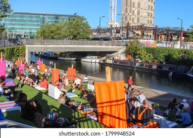 London / UK - August 4 2020: Granary Square, Kings Cross, London - Lollipop Social Distancing Installation With People Drinking In The Sunshine