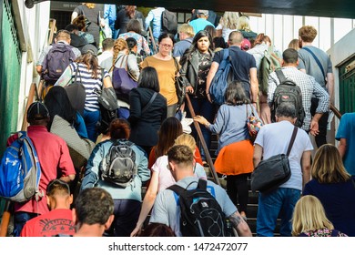 London, UK, August 6, 2019: Crowd Of People Coming In And Out Of The Tube Station 