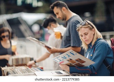 London UK - August 7, 2021: People Buying Vinyls At The Classic Car Boot Sale, A Retro Culture Festival.