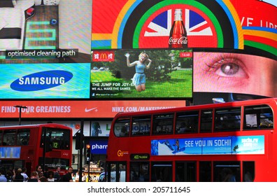 LONDON, UK - AUGUST 9, 2012: Tourists Visit Piccadilly Circus, Major Commercial Area Of London, Home Of Important Landmarks And Shops.