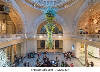 LONDON, UK - CIRCA JANUARY, 2018: Victoria and Albert Museum hall. V&A Museum is the world's largest museum of decorative arts. In 2000, an 11-metre high, blown glass chandelier by Dale Chihuly.