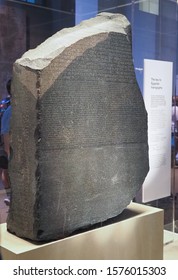 LONDON, UK - CIRCA SEPTEMBER 2019: Rosetta Stone Stele At The British Museum With Text In Ancient Egyptian Hieroglyphic, Demotic Scripts And Ancient Greek