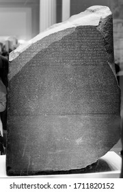 LONDON, UK - CIRCA SEPTEMBER 2019: Rosetta Stone Stele At The British Museum With Text In Ancient Egyptian Hieroglyphic, Demotic Scripts And Ancient Greek In Black And White