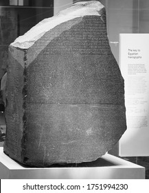 LONDON, UK - CIRCA SEPTEMBER 2019: Rosetta Stone Stele At The British Museum With Text In Ancient Egyptian Hieroglyphic, Demotic Scripts And Ancient Greek In Black And White