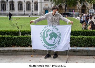 LONDON, UK – Circa September 2020: Man Holds A Banner Saying Muslim Ecological Consciousness And Climate Action During An Extinction Rebellion Protest At Parliament Square.