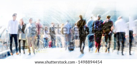 London, UK. Crowd of people walking at work in early morning. Concept wide background with  space for text. Multiple exposure image