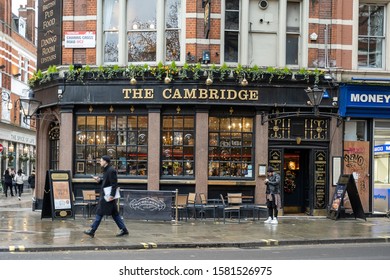 London / UK - Dec 01, 2019:  People Walking Past The Cambridge Pub On Neal Street In London, UK. Pubs Are Big Part Of British Culture. Selective Focus