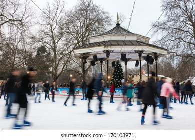 LONDON, UK - DECEMBER 13, 2012: People ice skate at the Winter Wonderland ice rink in Hyde Park.