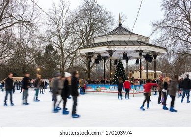 LONDON, UK - DECEMBER 13, 2012: People ice skate at the Winter Wonderland ice rink in Hyde Park.