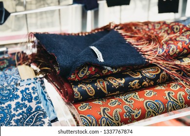 London, UK - December 18, 2018: Close up of a stack of paisley scarves on the window display of Peckham Rye shop in Covent Garden, a famous tourist area in London with lots of shops and restaurants.