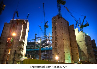 LONDON, UK - DECEMBER 19, 2014: Building Site With Cranes In The City Of London Business. New Development Next To Bank Of England. Night View