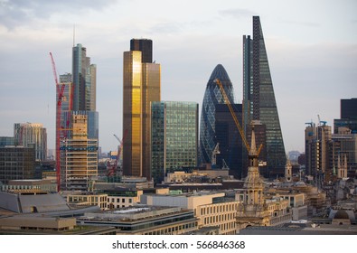 London, UK - December 19, 2016: City of London business aria view at sunset. View includes Gherkin building. City of London the leading financial centre in the Europe.  - Shutterstock ID 566846368