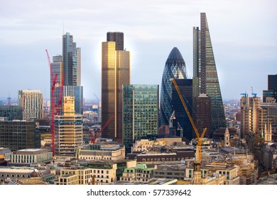 London, UK - December 19, 2016: City of London business aria view at sunset. View includes Gherkin and modern skyscrapers of leading financial companies - Shutterstock ID 577339642
