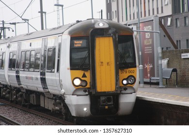 London, UK - December 25, 2016: Stansted Express / Greater Anglia Class 379 Train Approaching Tottenham Hale Station In London