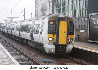 London, UK - December 25, 2016: Stansted Express / Greater Anglia Class 379 Train Approaching Tottenham Hale Station In London