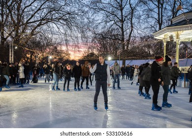 LONDON, UK - DECEMBER 4, 2016
Hyde Park Winter Wonderland traditional fun fair with food and drink  stalls, carousels, prizes to win, and Christmas activities.People and families ice skating