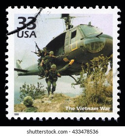 London, UK, December 7 2010 - Vintage 1999 United States Of America Cancelled Postage Stamp With 1960's Vietnam War USA Soldier Marines Entering Battle From A Helicopter