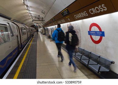 London, UK - December 8th, 2016: Tourists taking the train at Charing Cross tube station. 