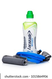 LONDON, UK - FEBRUARY 02, 2018: Bottle Of Lucozade Low Calories Sport Energy Soda Drink With Resistance Band On White Background.