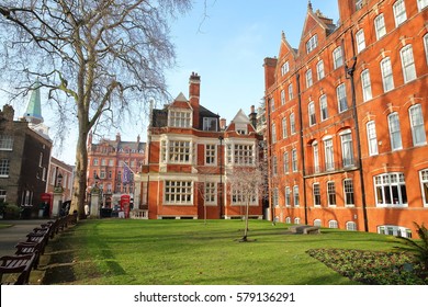 LONDON, UK - FEBRUARY 13, 2017: Mount Street Gardens with Red brick Victorian houses facades in the borough of Westminster 