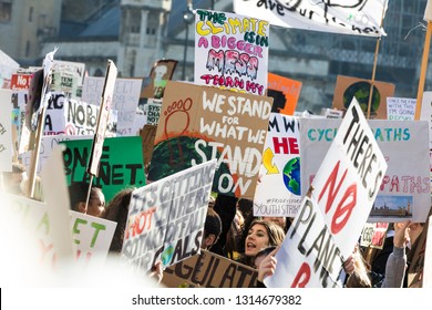 LONDON, UK - February 15, 2019: Protestors with banners at a Youth strike for climate march in central London