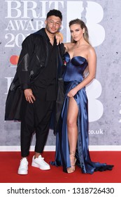 LONDON, UK. February 20, 2019: Alex Oxlade Chamberlain & Perry Edwards Arriving For The BRIT Awards 2019 At The O2 Arena, London.
Picture: Steve Vas/Featureflash
*** EDITORIAL USE ONLY ***