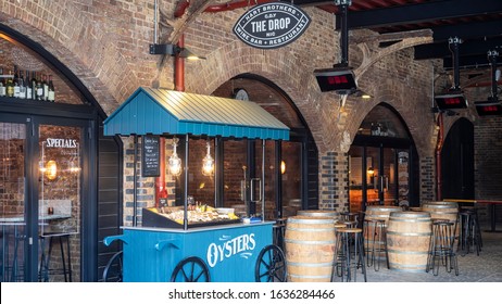 LONDON, UK - FEBRUARY 20, 2019:   Oyster Cart Outside Drops Wine Bar Restaurant In Coal Drops Yard