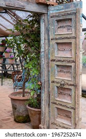 London UK. February 2020. Entrance With Chabby Chic Blue Wooden Door To The Greenhouse Cafe At Petersham Nurseries Garden Centre, Richmond Upon Thames, London UK