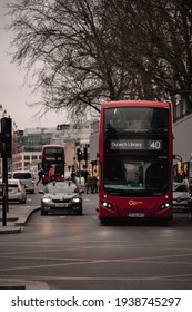 London UK February 2021 Cold Vertical Winter Shot Of A Number 40 London Bus Waiting On An Intersection, Going To Dutwitch Library During UKs National Covid Lockdown