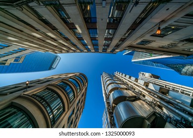 LONDON, UK - FEBRUARY 23, 2019: Upward View Of  Modern Skyscrapers In The City Of London, The Heart Of Financial District In London. Over 300,000 People Work There, Mainly In Financial Services Sector