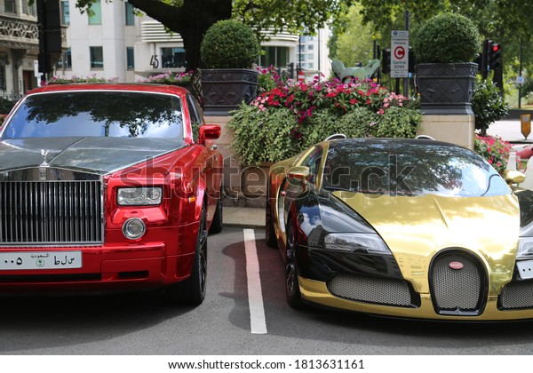 london, uk - jan 1, 2014, gold and black bugatti\
veyron w16
