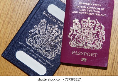 London, UK: January 04, 2018: An old blue British Passport under a new red European Union Passport. The British passport is due to return to use when Britain leaves the European Union in March 2019. 