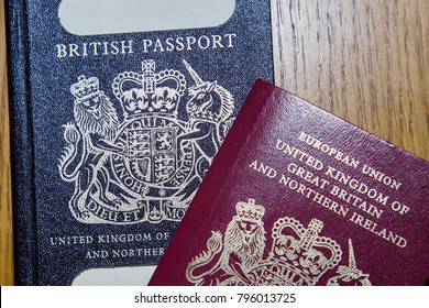 London, UK: January 04, 2018: An old blue British Passport under a new red European Union Passport. The British passport is due to return to use when Britain leaves the European Union in March 2019. 
