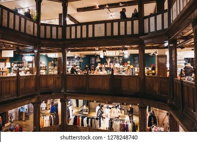 London, UK - January 05, 2019: People shopping inside Liberty Department Store in Oxford Circus, London. Opened in 1875, it is famous for luxury goods and classic Liberty designs.