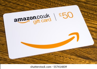 LONDON, UK - JANUARY 13TH 2017: A close-up shot of a 50 Pounds Amazon Gift Card on a table, on 13th January 2017.