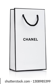 LONDON, UK - JANUARY 15, 2019: Paper Chanel Shopping Bag, White With Black Stripes And Letters On White 