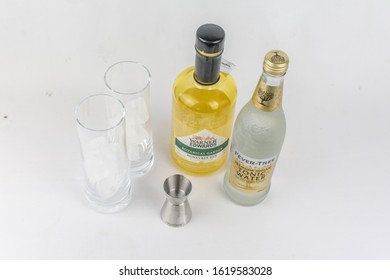 London, UK - January 17 2020 - Warners Honeybee Gin With A Fever Tree Tonic Water, Two Glasses And A Shot Measurer