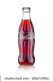 LONDON, UK - JANUARY 20, 2018: Cold glass bottle of Diet Coca Cola drink  on white background. The drink is produced and manufactured by The Coca-Cola Company.