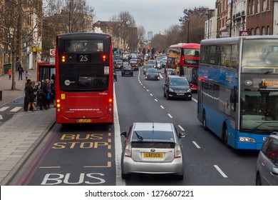 London UK - January 2019 - Busy London Road With Red Busses And Troad Traffic During Daytime